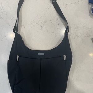 Baggallini cross body. 14 x 9. Perfect for travel. Used once.